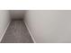 Narrow, carpeted hallway provides access to a home, offering comfort and practicality at 2705 S Danube Way # 110, Aurora, CO 80013