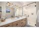 Bathroom with double vanity, large shower and modern fixtures at 760 Jersey St, Denver, CO 80220