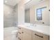 Bathroom with shower, vanity, and gray tile at 760 Jersey St, Denver, CO 80220