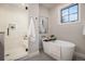 Bathroom with soaking tub, shower, and modern design at 760 Jersey St, Denver, CO 80220