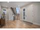 Modern entryway with hardwood floors and a sleek staircase at 760 Jersey St, Denver, CO 80220