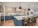 Modern kitchen with blue cabinetry, large island, and quartz countertops at 760 Jersey St, Denver, CO 80220