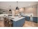 Modern kitchen with blue cabinetry, large island, and stainless steel appliances at 760 Jersey St, Denver, CO 80220