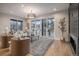 Living room with fireplace, hardwood floors, and large windows at 760 Jersey St, Denver, CO 80220