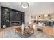 Open living room showcasing a modern fireplace and kitchen with island at 760 Jersey St, Denver, CO 80220