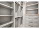 Large walk-in closet with shelves, drawers, and hanging rods at 760 Jersey St, Denver, CO 80220