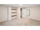 Basement area featuring built-in shelving, neutral paint, and open layout at 2646 Colorado Blvd, Denver, CO 80207