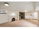 Basement area with a fireplace, offering versatility and potential for additional living space at 2646 Colorado Blvd, Denver, CO 80207