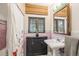 Charming bathroom with a vintage-style sink, and original tile accents at 2646 Colorado Blvd, Denver, CO 80207