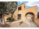 Charming home featuring a stucco facade, arched entrance, and well-maintained landscaping at 2646 Colorado Blvd, Denver, CO 80207