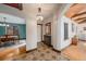 Hallway with patterned tile flooring, chandelier, and access to dining room at 2646 Colorado Blvd, Denver, CO 80207