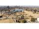 Expansive aerial shot features a lake surrounded by trees, pathways, and the Denver skyline at 1557 Fillmore St, Denver, CO 80206