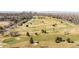 Vast aerial shot featuring a well-manicured golf course with scattered trees and downtown Denver skyline at 1557 Fillmore St, Denver, CO 80206