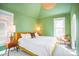 Bright bedroom with modern decor, plush bed, and ample natural light at 1557 Fillmore St, Denver, CO 80206
