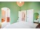 Bedroom with a view into a walk-in closet and en-suite bathroom at 1557 Fillmore St, Denver, CO 80206