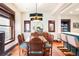 Elegant dining room with classic wood furniture and updated lighting fixtures at 1557 Fillmore St, Denver, CO 80206