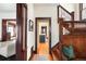 Classic foyer with hardwood floors, wooden staircase, and views to the kitchen at 1557 Fillmore St, Denver, CO 80206