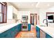 Updated kitchen with stainless appliances, modern cabinets, and beautiful wood floors at 1557 Fillmore St, Denver, CO 80206