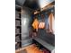 Mudroom featuring built-in storage, bench seating, and hardwood floors at 1557 Fillmore St, Denver, CO 80206