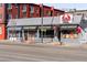 Street view of Crab Shell restaurant with prominent signage, seating, and Cajun seafood menu at 1557 Fillmore St, Denver, CO 80206