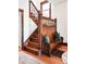 Charming foyer boasts original wood staircase and built-in bench with storage at 1557 Fillmore St, Denver, CO 80206