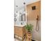 Spa-like bathroom with a modern vanity, a walk-in shower, and wood accents at 1227 S Patton Ct, Denver, CO 80219