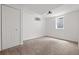 Cozy bedroom with a double closet, carpeted floors, natural light and white walls at 5329 Flower Cir, Arvada, CO 80002