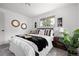 Sun-filled bedroom with modern decor, comfortable bed, and relaxing ambiance at 5329 Flower Cir, Arvada, CO 80002