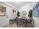 Dining space features a modern rug, plants, and a view to the exterior at 5329 Flower Cir, Arvada, CO 80002