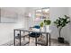 Stylish home office features a modern desk, velvet chair, and lots of natural light at 5329 Flower Cir, Arvada, CO 80002
