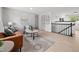 Spacious living room with contemporary furnishings, natural light, and an open floor plan at 5329 Flower Cir, Arvada, CO 80002
