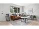 Bright living room with contemporary decor, a large window, and stylish furnishings at 5329 Flower Cir, Arvada, CO 80002