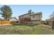 Exterior view of home with yard space from a low angle at 5987 S Pierson St, Littleton, CO 80127