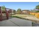 Large backyard with steps leading up to a deck overlooking the grassy area at 5987 S Pierson St, Littleton, CO 80127