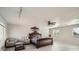 Spacious primary bedroom boasting stylish furniture, large windows, and ample natural light at 5987 S Pierson St, Littleton, CO 80127