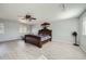 Bright and spacious bedroom with a decorative bed, lots of natural light, and modern decor at 5987 S Pierson St, Littleton, CO 80127