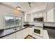 Well lit Kitchen with white cabinets at 5987 S Pierson St, Littleton, CO 80127