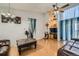 Spacious living room featuring hardwood floors and ample natural light at 5987 S Pierson St, Littleton, CO 80127