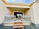 Inviting back patio featuring a white railing, providing a secure and stylish space for relaxation and outdoor enjoyment at 9032 Middle Fork St, Littleton, CO 80125