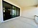 An open patio with a large sliding glass door, blending indoor and outdoor living for seamless entertaining at 9032 Middle Fork St, Littleton, CO 80125