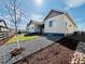 A backyard view of a light and airy home with a fresh green lawn and a serene, private outdoor space at 9032 Middle Fork St, Littleton, CO 80125