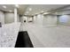 Finished basement includes granite countertops and a kitchen area, perfect for entertaining guests at 9032 Middle Fork St, Littleton, CO 80125