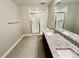 Bathroom featuring a granite countertop, double sinks and glass shower at 9032 Middle Fork St, Littleton, CO 80125