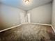 Unfurnished bedroom with neutral walls and carpet at 9032 Middle Fork St, Littleton, CO 80125