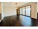 Dining area with dark hardwood floors and expansive sliding glass doors, offering a bright and inviting space for meals and gatherings at 9032 Middle Fork St, Littleton, CO 80125