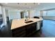Large kitchen island features stylish countertop and stainless steel dishwasher at 9032 Middle Fork St, Littleton, CO 80125