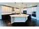Gourmet kitchen features an island, modern appliances, and stylish cabinetry at 9032 Middle Fork St, Littleton, CO 80125