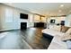 Open-concept living space blends seamlessly with the modern kitchen at 9032 Middle Fork St, Littleton, CO 80125
