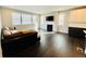 Cozy living room with fireplace and large windows at 9032 Middle Fork St, Littleton, CO 80125