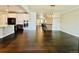 Bright open floor plan with hardwood floors and easy access to stairs and kitchen at 9032 Middle Fork St, Littleton, CO 80125
